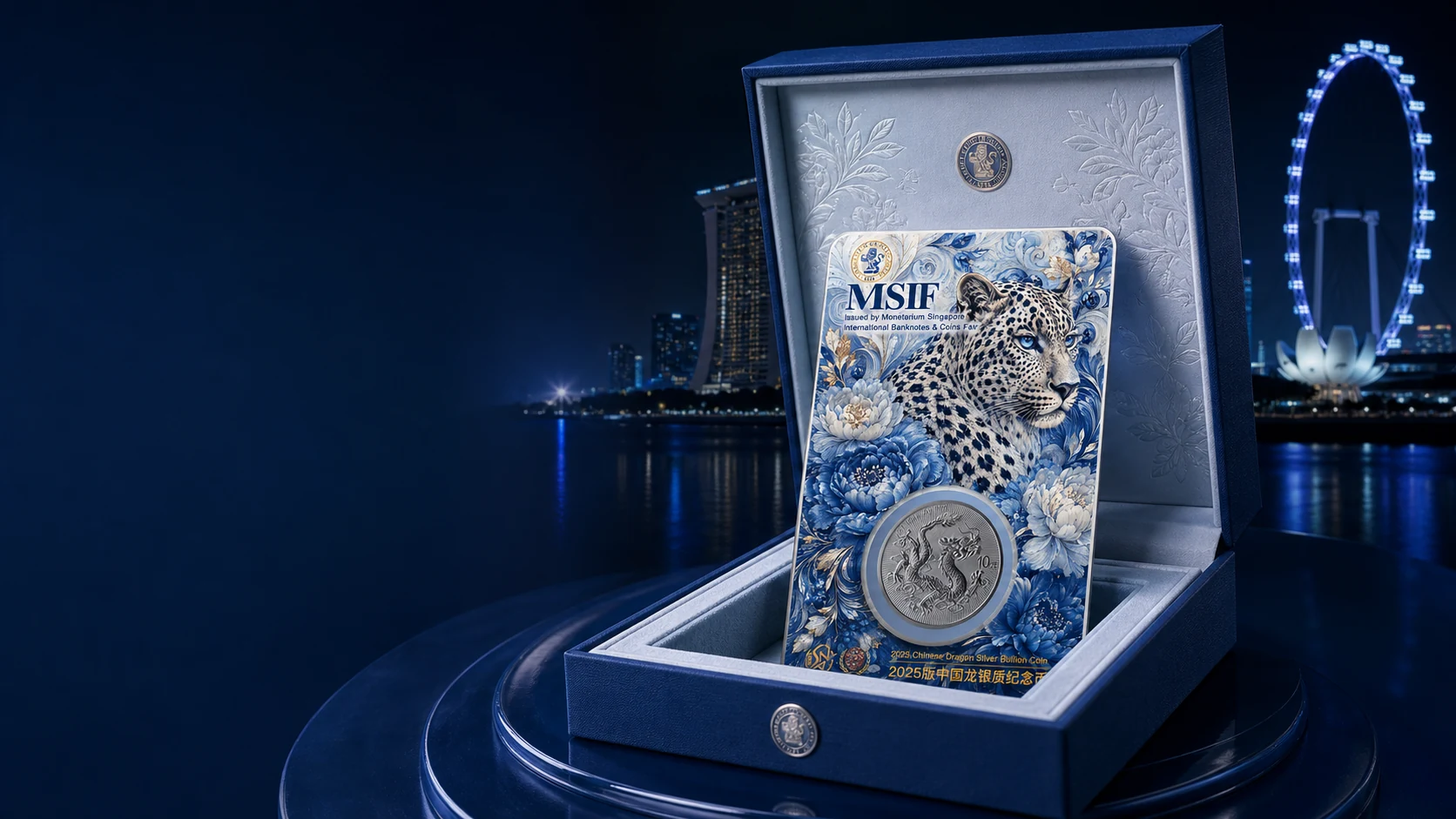 Ice-blue Snow Leopard Dragon Coin card in its premium presentation box